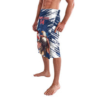 Blue knee-length swim shorts with eagle graphic, grunge brush stripes and red-white details