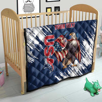 Blue and white quilt on a wooden crib, quilted design with eagle graphic and red “YOUR TEXT”