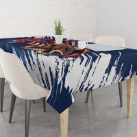 Blue tablecloth with white brush streaks, draped over dining table