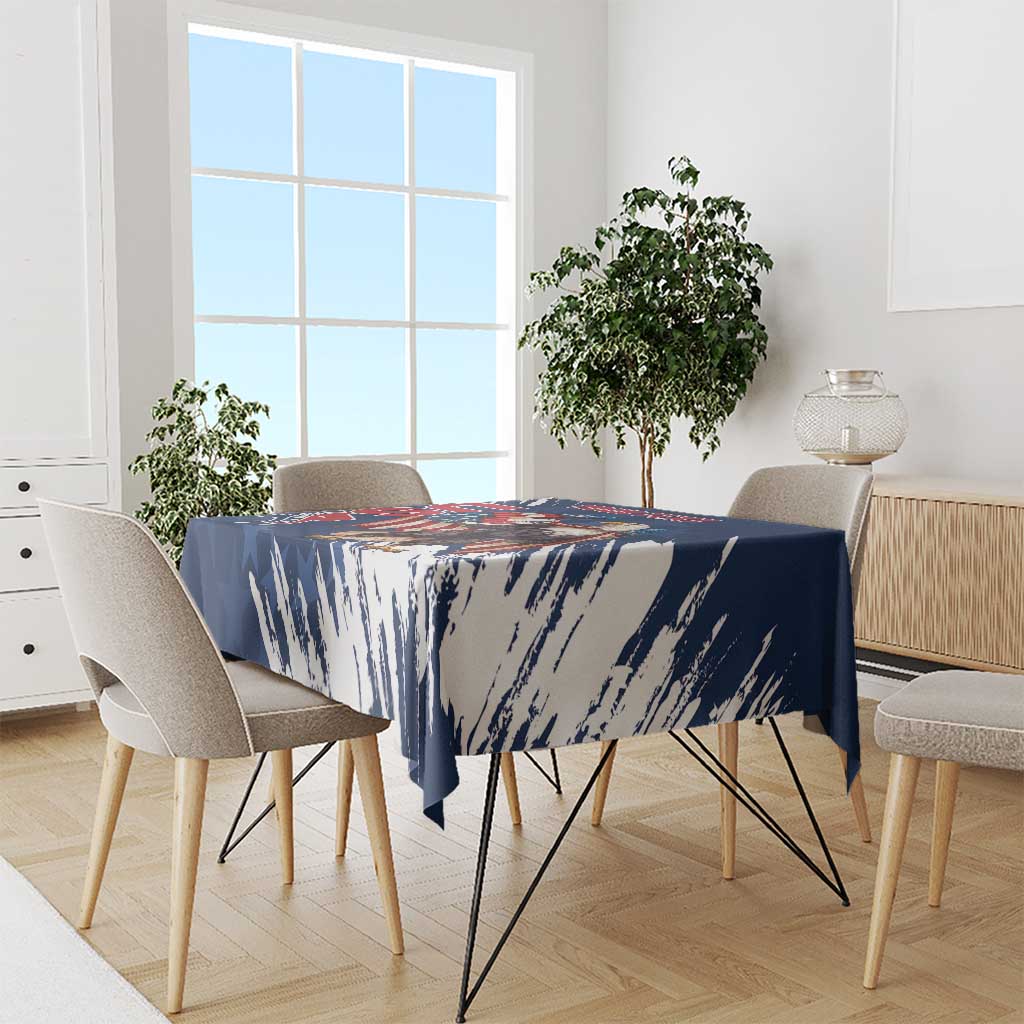 Blue tablecloth with brush-stroke pattern, covering rectangular dining table