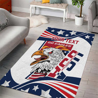 White area rug with navy and red star border, eagle logo, and bold custom text