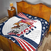 Custom quilt blanket on a bed with blue star corners, red stripes, and eagle emblem
