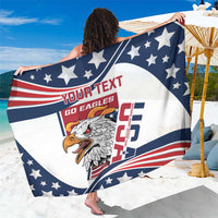White and navy star-pattern sarong featuring eagle head graphic and red border stripes.