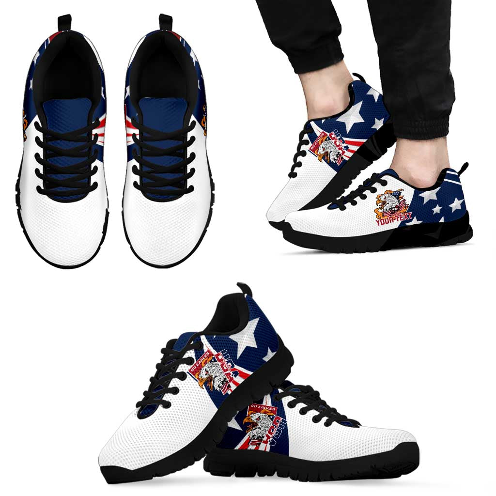 White and blue low-top sneakers with eagle badge and stars, black outsole, lace-up
