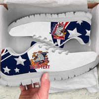 White and blue low-top sneakers with eagle patch and star pattern, black outsole, close view