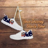 White and blue low-top sneakers with eagle patch and star pattern, white outsole, laces up