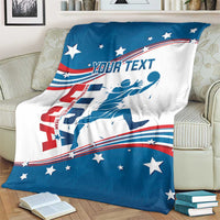 Basketball blanket on couch with blue border, white center, stars, red stripes, and player artwork