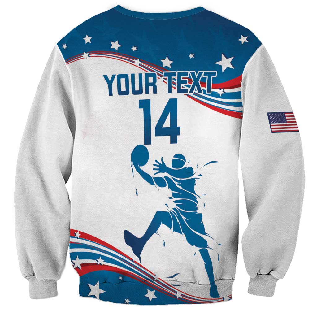 White basketball sweatshirt with blue stars-and-stripes graphic, player silhouette, and sleeve USA flag