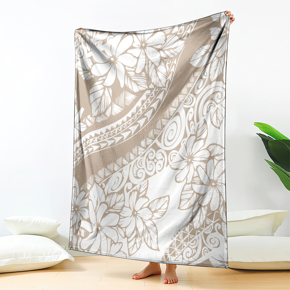 Beige and white tropical floral print blanket, draped over a chair