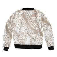 Beige bomber jacket with white floral and leaf print, ribbed collar, cuffs, and hem