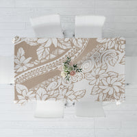 Beige and white tropical leaf and flower tablecloth with ornate botanical line pattern