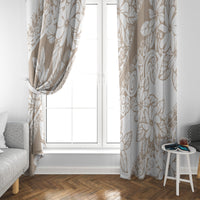 Beige tropical leaf and flower print window curtain framing a white door