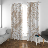 Beige window curtains with tropical leaf and flower print beside a small side table