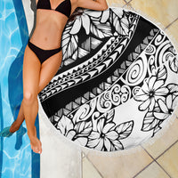 Round beach blanket with black and white floral tribal design and white fringe border