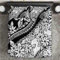 Black-and-white floral bedding set with tribal swirl and leaf patterns on duvet cover