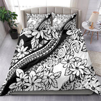 Black-and-white tropical floral bedding set with two matching pillowcases and tribal patterns