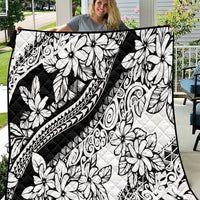 Black-and-white quilt with tropical flower and geometric scroll patterns