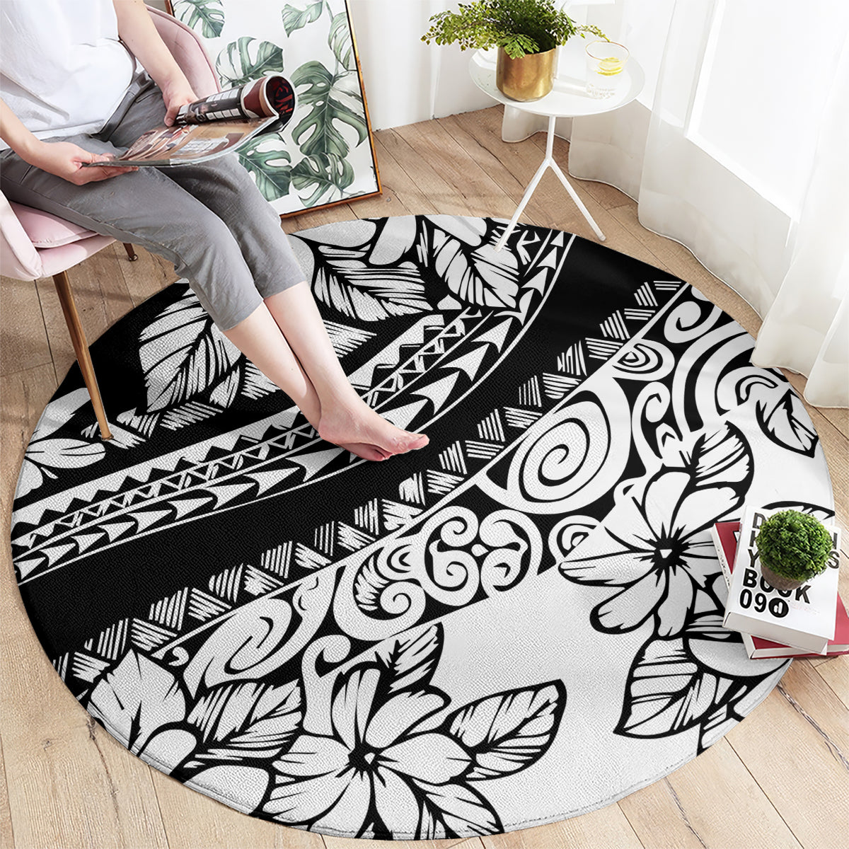 Black round carpet with white tropical flowers, swirls, and geometric stripe details