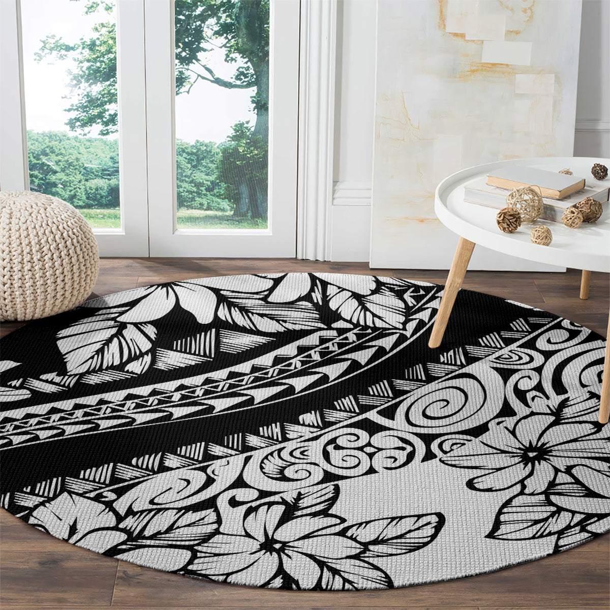 Black round carpet with white tropical leaves, flowers, and geometric border pattern