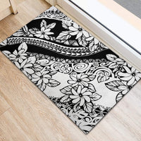 Black and white tropical floral rubber doormat with ornate swirls