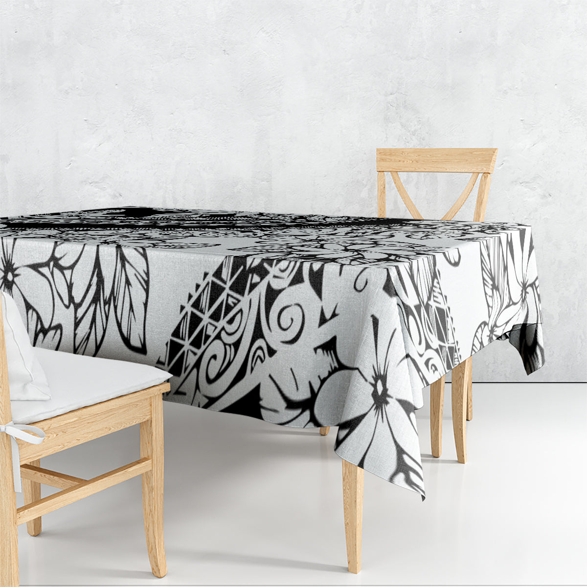 Black-and-white patterned tablecloth draped over dining table