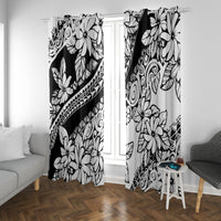 Black and white tropical floral curtains with scroll and flower print, hung across two windows