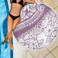Purple round beach blanket with white floral leaf pattern and fringed trim
