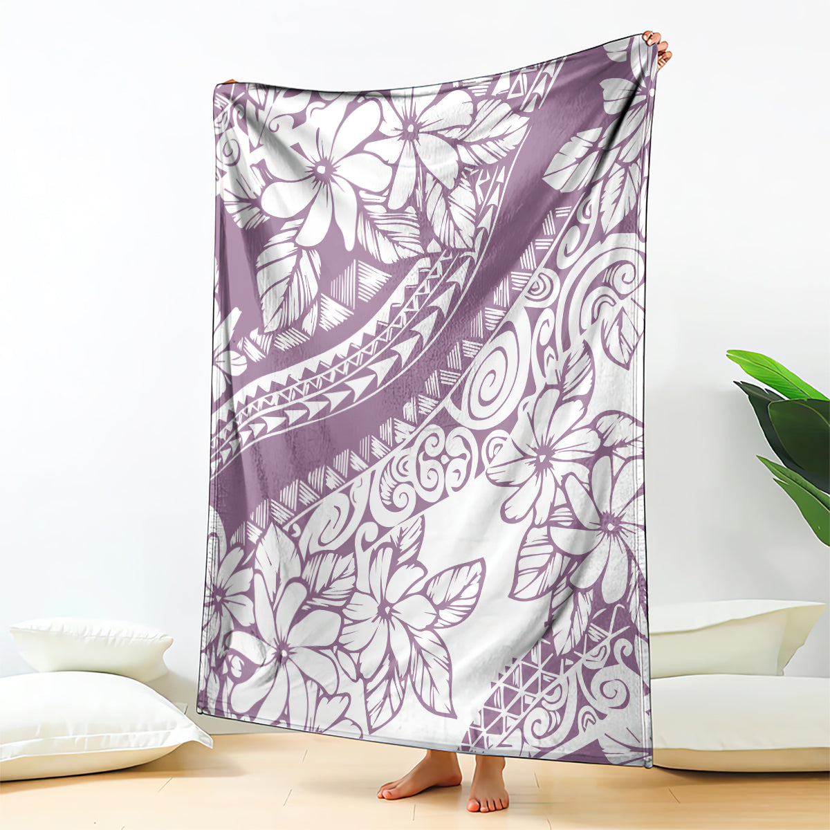Purple and white Polynesian floral throw blanket, draped over furniture edge