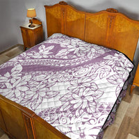 Purple and white quilt blanket with tropical flower and swirl prints, black-edged border
