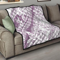 Purple and white floral quilt with tiki swirl and arch prints, black border, quilted texture