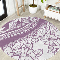 Purple round rug with white tropical flower and leaf motifs, abstract tribal patterns