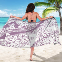 Purple floral sarong draped wide, white hibiscus and swirling geometric pattern