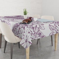 Purple floral tablecloth with corner drop, patterned surface covering the table.
