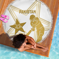 White round beach blanket with gold Pakistan text, star and cricketer graphic, fringed edge