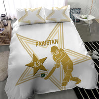 White bedding duvet with two pillowcases, gold star, Pakistan text, and wicket player design