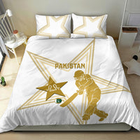 White duvet and two pillowcases with gold Pakistan crest, star, and cricket batter graphic