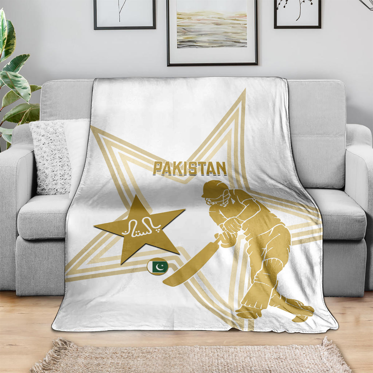 White cricket blanket draped on sofa, gold Pakistan text, star and player graphic
