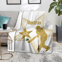 White Pakistan cricket blanket on sofa, gold star and cricketer graphic