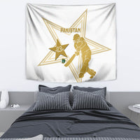 White wall tapestry with gold Pakistan text, star emblem, and cricket player illustration