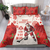 Red and white Christmas hockey bedding set with Santa figure and “MERRY HOCKEY-MAS” text, two pillows.