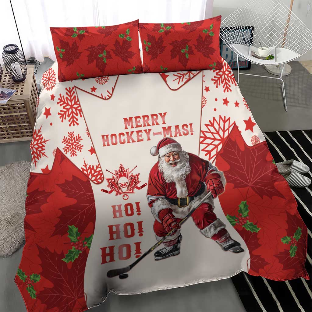 Close view of red and white Christmas hockey bedding set with Santa, maple leaves, and “HO HO HO” text.