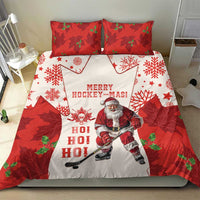 Red and white Christmas hockey bedding set with Santa skating, snowflakes, and two matching red pillowcases.