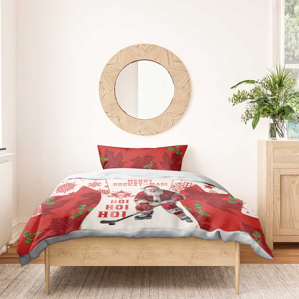 Red and white Christmas hockey bedding set on wooden bed frame with Santa and maple leaf graphics.