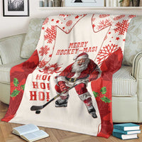 Red and white holiday hockey blanket with Santa hockey player, star and snowflake pattern