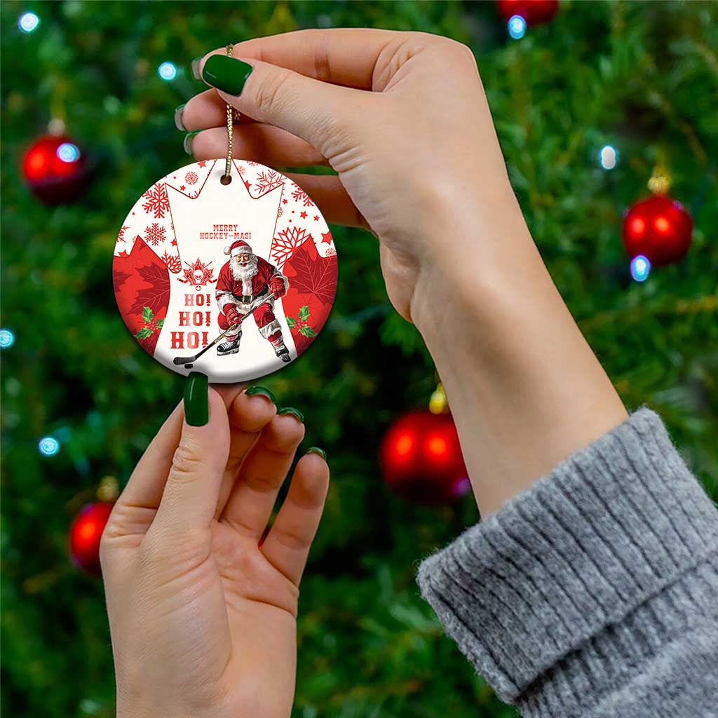 Red hockey-themed ceramic Christmas ornament with Santa and maple leaf pattern, circle shape