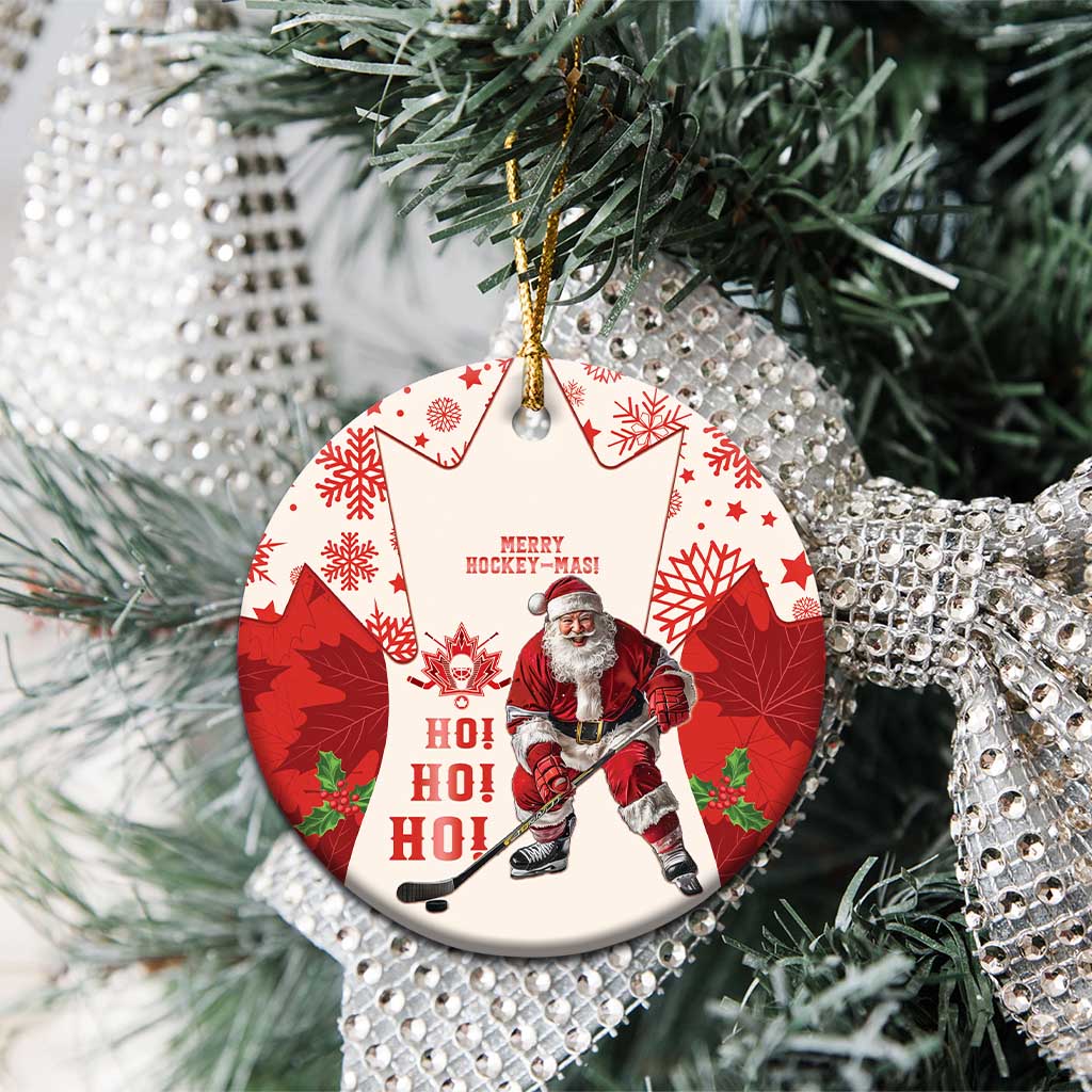 Red hockey-themed ceramic Christmas ornament with Santa and maple leaf pattern, circle close-up