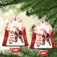 Red hockey-themed ceramic Christmas ornament with Santa and maple leaf pattern, tree shape