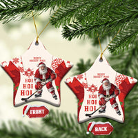 Red hockey-themed ceramic Christmas ornament with Santa and maple leaf pattern, star shape