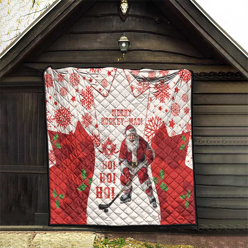 Christmas hockey quilt hanging on a wall in red and white with maple leaves, snowflakes, Santa