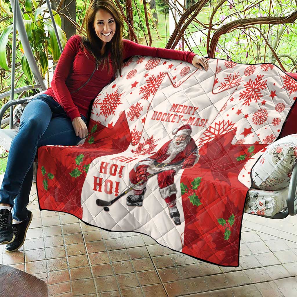 Christmas hockey quilt draped over outdoor chair: red and white with maple leaves and Santa